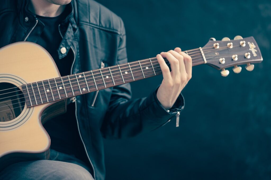man holding a guitar