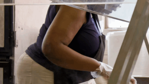 Cafeteria worker preparing food